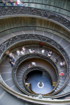 Vatican City Museums Tourists descending the Spiral Ramp designed by Giuseppe Momo in 1932 leading from the museums to the street level belowEuropean Italia Italian Roma Southern Europe Catholic Prin...
