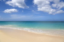 Waves breaking on the shoreline at Grand Anse beach with the turqoise sea beyondBeaches Resort Sand Sandy Scenic Seaside Shore Tourism West Indies Caribbean Grenadian Greneda Beaches Resort Sand San...