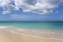 Waves breaking on the shoreline at Grand Anse beach with the turqoise sea beyondBeaches Resort Sand Sandy Scenic Seaside Shore Tourism West Indies Caribbean Grenadian Greneda Beaches Resort Sand San...