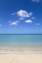 Gentle waves breaking on Morne Rouge beach known locally as BBC Beach with the turqoise sea beyondBeaches Resort Sand Sandy Scenic Seaside Shore Tourism West Indies Caribbean Grenadian Greneda Beach...