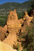 Colorado Provencal.  Cheminee de Fee or Fairy Chimneys.  Eroded ochre rock pinnacles and surrounding landscape from view point.  Ochre Trail European French Western Europe Scenic