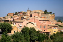 Roussillon.  General view of the town buildings clustered on hillside  the town is famous for it s houses of red coloured stone.European French Western Europe Colored