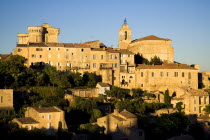 Gordes.  Hilltop village houses  church and sixteenth century chateau in warm glow of evening light.16th c. castle European French Western Europe Castillo Castello Scenic Warm Light Castle Castello C...