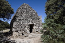 Le Village des Bories.  Primitive village comprising of mortarless stone  beehive shaped huts each with a specific agricultural or dwelling purpose  pictured is a barn.  The village was restored in 19...