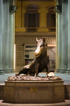 The 17th century water fountain Il Porcellino in the Mercato Nuovo or New Market illuminated at night. A bronze copy of a Roman marble wild boar that is in the Uffizi. A superstition exists that if a...