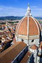 The Dome of the Cathedral of Santa Maria del Fiore the Duomo by Brunelleschi with tourists on the viewing platform looking over the city towards the surrounding hillsEuropean Italia Italian Southern...