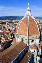 The Dome of the Cathedral of Santa Maria del Fiore the Duomo by Brunelleschi with tourists on the viewing platform looking over the city towards the surrounding hillsEuropean Italia Italian Southern...