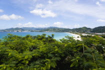Grand Anse Beach seen across the tops of trees looking towards the inland hills surrounding the bayScenic West Indies Beaches Caribbean Grenadian Greneda Resort Sand Sandy Seaside Shore Sunbather Tou...