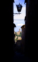 The Basilica di Santa Maria dei Servi seen down a dark side street took nearly 800 years to finish. Serviti monks began planning the church in the early 1300s but the basilica was not consecrated unti...