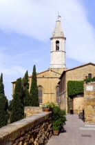 Val D Orcia The belltower of the Duomo built in 1459 by the architect Rossellino for Pope Pius II seen from the Via Dell Amore with cypress trees European Italia Italian Southern Europe Toscana Tusca...