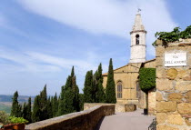 Val D Orcia The belltower of the Duomo built in 1459 by the architect Rossellino for Pope Pius II seen from the Via Dell Amore with cypress trees European Italia Italian Southern Europe Toscana Tusca...