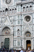 The Neo-Gothic marble west facade of the Cathedral of Santa Maria del Fiore with tourists walking in the square at the frontEuropean Italia Italian Southern Europe Toscana Tuscan Firenze Holidaymaker...