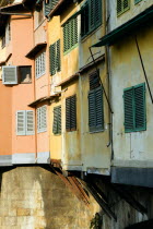 Detail of the 14th century Ponte Vecchio or Old Bridge across the River Arno showing the rear of the artisans housesEuropean Italia Italian Southern Europe Toscana Tuscan Firenze History