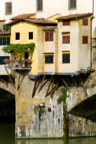 Detail of the 14th century Ponte Vecchio or Old Bridge across the River Arno showing the rear of the artisans housesEuropean Italia Italian Southern Europe Toscana Tuscan Firenze History