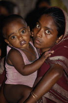 Portrait of young woman holding child.Asia Asian Bangladeshi Children Female Women Girl Lady Immature Kids Asia Asian Bangladeshi Children Female Women Girl Lady Immature Kids