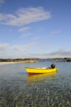 Yellow boat anchored in clear watersAlba Great Britain Northern Europe UK United Kingdom British Isles European  Alba Great Britain Northern Europe UK United Kingdom British Isles European