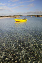 Yellow boat anchored in clear waters wide angleAlba Great Britain Northern Europe UK United Kingdom British Isles European  Alba Great Britain Northern Europe UK United Kingdom British Isles Europea...