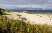 Grasses and sandy beach with views of MullAlba Beaches Great Britain Northern Europe Resort Seaside Shore Tourism UK United Kingdom British Isles European Sand Sandy Beach Tourism Seaside Shore Touri...