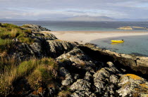 Rocks & sandy beach with views of Mull & yellow boatAlba Beaches Great Britain Northern Europe Resort Seaside Shore Tourism UK United Kingdom British Isles European Sand Sandy Beach Tourism Seaside S...