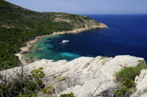 Rocky coastline & deep blue waters with boat  coastline near Calviwide angle Northern French Western Europe European wide angle Northern French Western Europe European