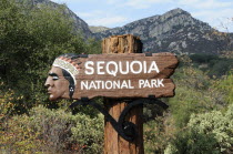 Wooden park sign and mountain viewsNorth America United States of America American National Park Northern Signs Display Posted Signage The Golden State North America United States of America America...