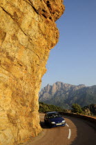 Golden rock face with coastal road & car  near PortoAutomobile Automotive Cars Motorcar Oporto Automobiles Automvil Autos French Western Europe European Automobile Automotive Cars Motorcar Oporto A...