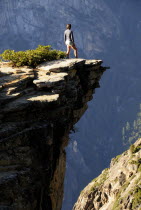 Cliff edge with figure looking into ravine  Taft Pointportrait North America United States of America American National Park Northern Cliffs Drop Steep Overlooking The Golden State portrait North Am...