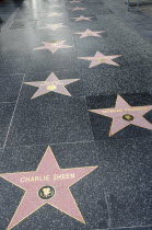 Hollywood Walk of Fame along Hollywood Boulevard showing stars of Charlie Sheen  Morgan Freeman & Ricardo Montalban.American BLVRD Destination Destinations North America Northern United States of Ame...