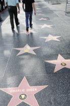 Hollywood Walk of Fame along Hollywood Boulevard showing stars of Charlie Sheen  Morgan Freeman & Ricardo Montalban.American Destination Destinations North America Northern United States of America G...