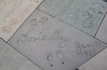 Doris Days tiny footprint  Manns Chinese Theatre  Hollywood. GraumanAmerican Asian Destination Destinations North America Northern Theater United States of America Gray LA Performance The Golden Stat...