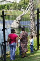 Family looking across La Brea Tar PitsMidtown American Destination Destinations North America Northern United States of America Immature Kids The Golden State