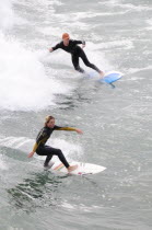 Riding the surf at Huntington BeachSouth Beaches American Destination Destinations North America Northern Resort Sand Sandy Seaside Shore Southern Tourism United States of America Gray LA Sand Sandy...