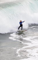 Riding the surf at Huntington BeachSouth Beaches American Destination Destinations North America Northern Resort Sand Sandy Seaside Shore Southern Tourism United States of America Gray LA One individ...