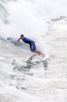 Riding the surf at Huntington BeachSouth Beaches American Destination Destinations North America Northern Resort Sand Sandy Seaside Shore Southern Tourism United States of America Gray LA One individ...