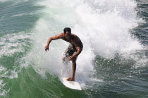 Surfer riding wave  Venice BeachVenice Beach American Beaches Destination Destinations North America Northern Resort Sand Sandy Seaside Shore Tourism United States of America LA One individual Solo L...