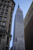 Empire state building seen from street level.American North AmericaArchitectureUrbanAmerican.CityscapeSkyscraperTowerTravelDestinationCityDestination Destinations North America Northern Unite...