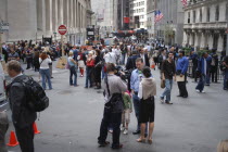 Financial District  Wall Street  Crowds of people and news reporter television crews outside the NY Stock Exchange building.American Destination North AmericaArchitectureUrbanNorth AmericanCityB...