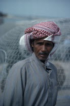 Portrait of man wearing traditional red and white arab headscarfal Kuwayt Arabic Classic Classical Historical Kuwaiti Male Men Guy Middle East Older One individual Solo Lone Solitary