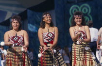 Maori girls doing Poi dance wearing grass skirts Antipodean Indigenous Oceania Performance