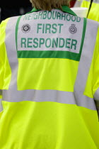 Findon village Sheep Fair St Johns Ambulance Neighbourhood First Response person in yellow reflective coat.Great Britain Northern Europe UK United Kingdom British Isles European