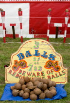 Findon village Sheep Fair Coconut shy with sign reading Beware of Rebounding Balls.Great Britain Northern Europe UK United Kingdom British Isles European