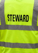 Findon village Sheep Fair The reflective jacket of a Steward.Great Britain Northern Europe UK United Kingdom British Isles European