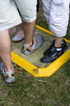 Findon village Sheep Fair People walking through a foot bath at a Bio Security Point to help prevent spread of foot and mouth disease.Great Britain Northern Europe UK United Kingdom British Isles Eur...