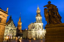 The 18th Century Hofkirche Catholic Cathedral of Saint Trinitatis and the illuminated tower of the Residenzschloss and the Grunes Gewelbe or Green Vault a museum that is part of Dresden Castle with a...