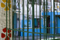 Green metal caging on a building in a colourful street in Clifton.Beaches Resort Sand Sandy Scenic Seaside Shore Tourism West Indies Caribbean Colorful Destination Destinations Sand Sandy Beach Touri...
