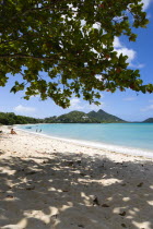 Waves breaking on Paradise Beach at LEsterre Bay with the turqoise sea and Point Cistern beyond.Beaches Resort Sand Sandy Scenic Seaside Shore Tourism West Indies Caribbean Destination Destinations G...