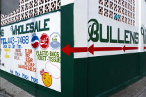 Hillsborough The freshly painted walls of Bullens Wholesale shop advertising food and drink and household goods.Beaches Caribbean Destination Destinations Grenadian Greneda Resort Sand Sandy Scenic S...