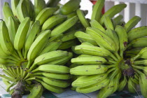 Hillsborough Bundles of green bananas on a stall in the main street.Beaches Caribbean Destination Destinations Grenadian Greneda Resort Sand Sandy Scenic Seaside Shore Tourism West Indies Grenada Far...