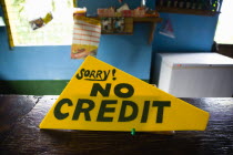 Sign on the counter of a shop that says Sorry No Credit.Caribbean Destination Destinations Grenadian Greneda West Indies Grenada Signs Display Posted Signage Store
