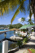 The capital of Clifton and the harbour seen from the terrace of the Anchorage Yacht Club restaurant and bar beside the shark pool.Caribbean West Indies Windward Islands Destination Destinations Inn P...